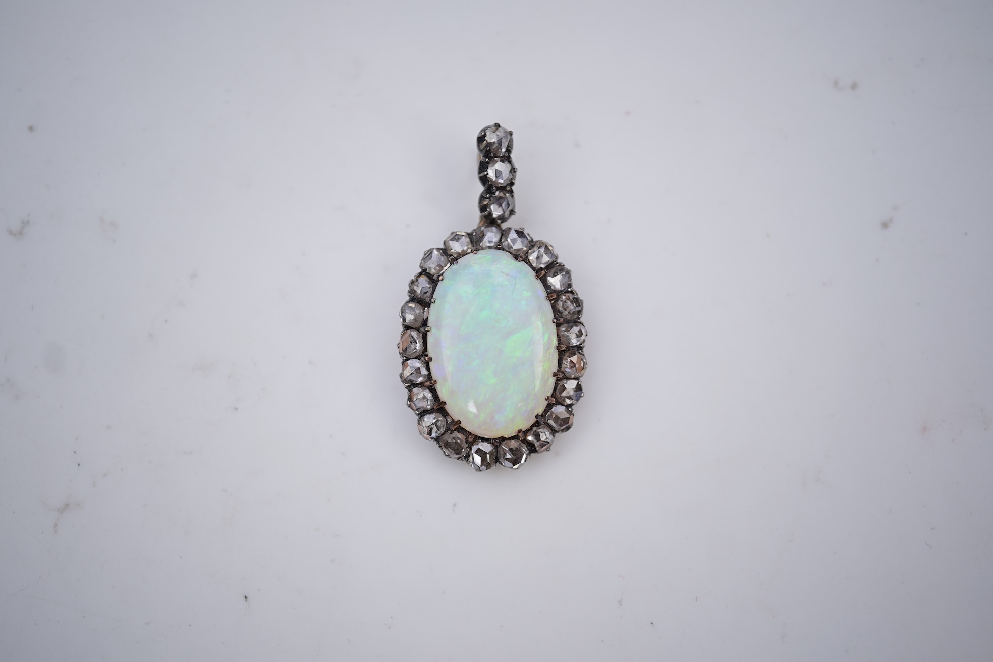 An opal and diamond pendant, early 20th century